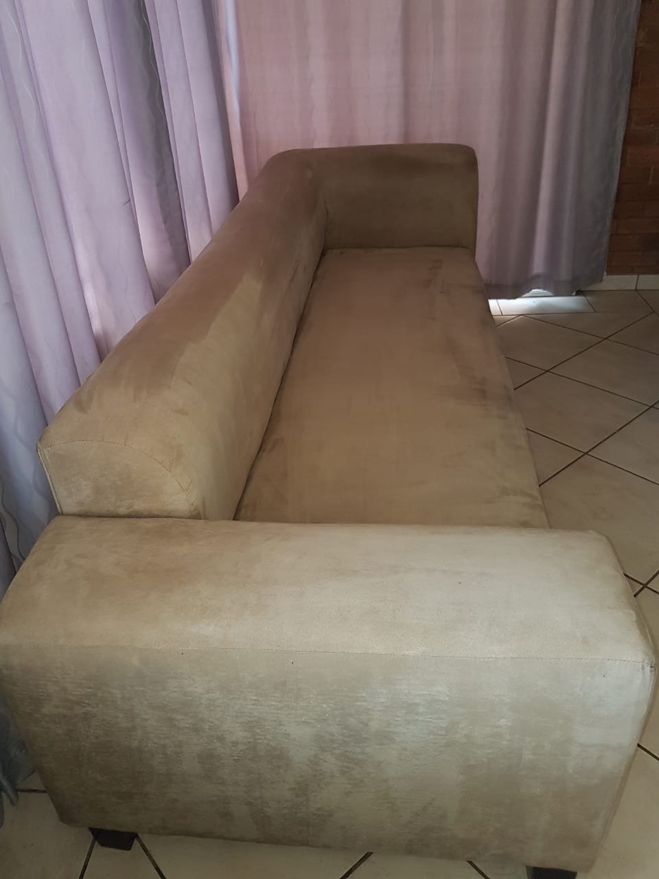 Four seater velour cream coloured couch