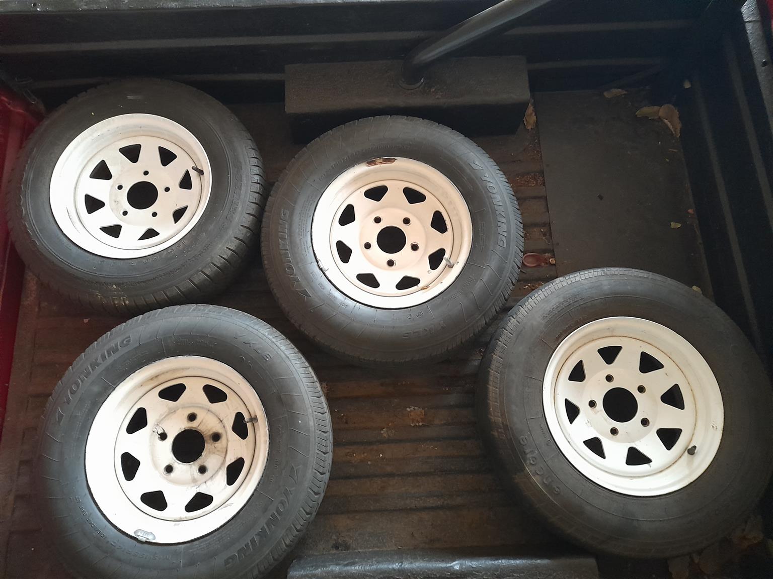Selling full set of rims with good tires,to fit Ford Cortina.