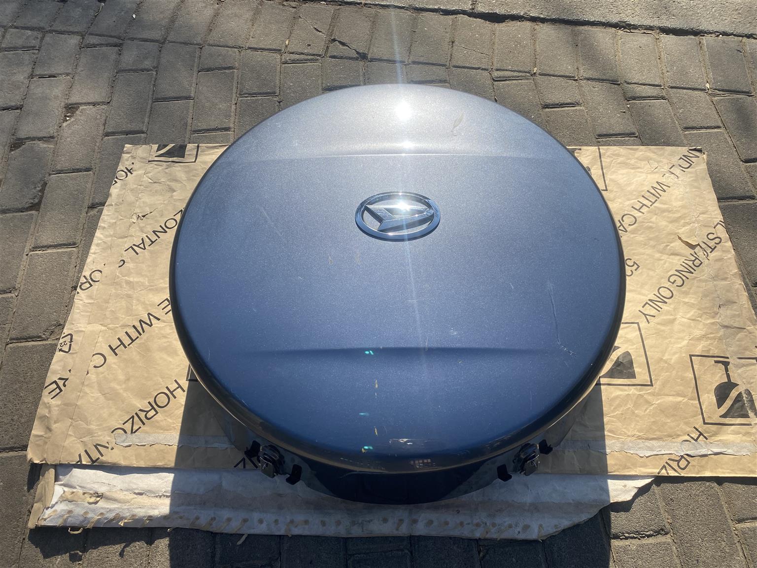 2010 DAIHATSU TERIOS COMPLETE SPARE WHEEL COVER FOR SALE. IN PRISTINE CONDITION