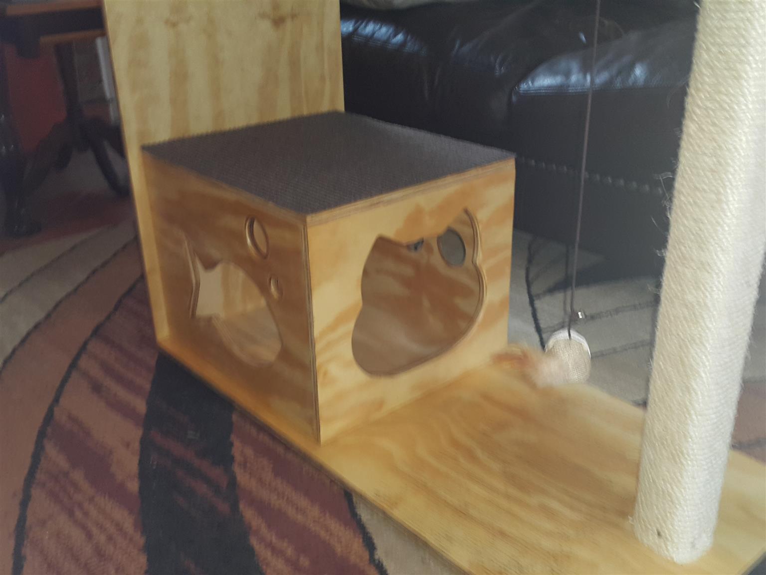 Wooden cat stand with scratching post
