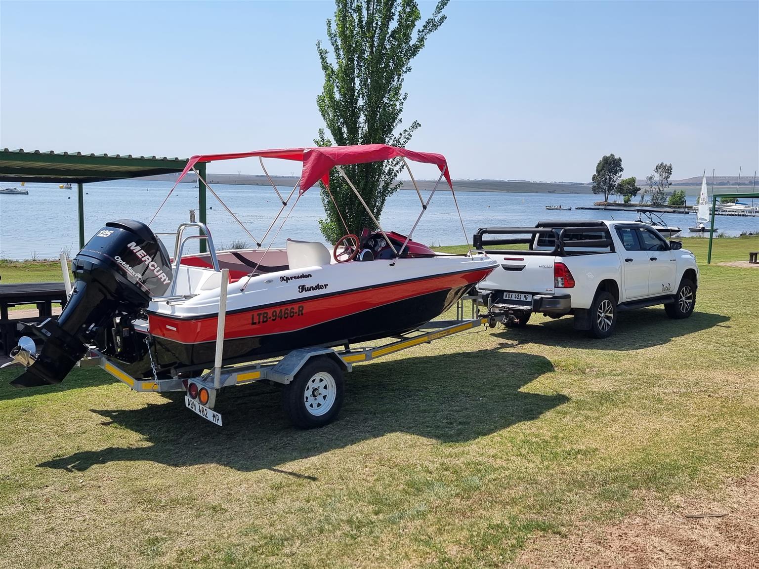 18 ft Exspression Funster boat with 150 Optimax Murcury Motor