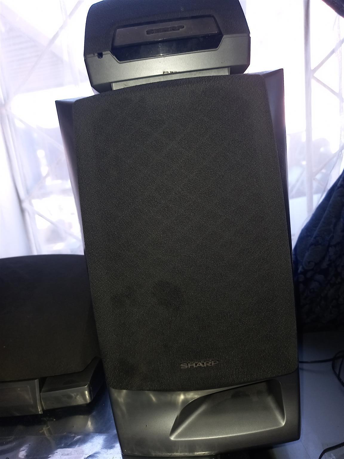 2 "Sharp" Hi Fi speakers including 2 surround & 1 centre speaker. 2 "Sharp" Hi Fi speakers including 2 surround & 1 centre speaker.