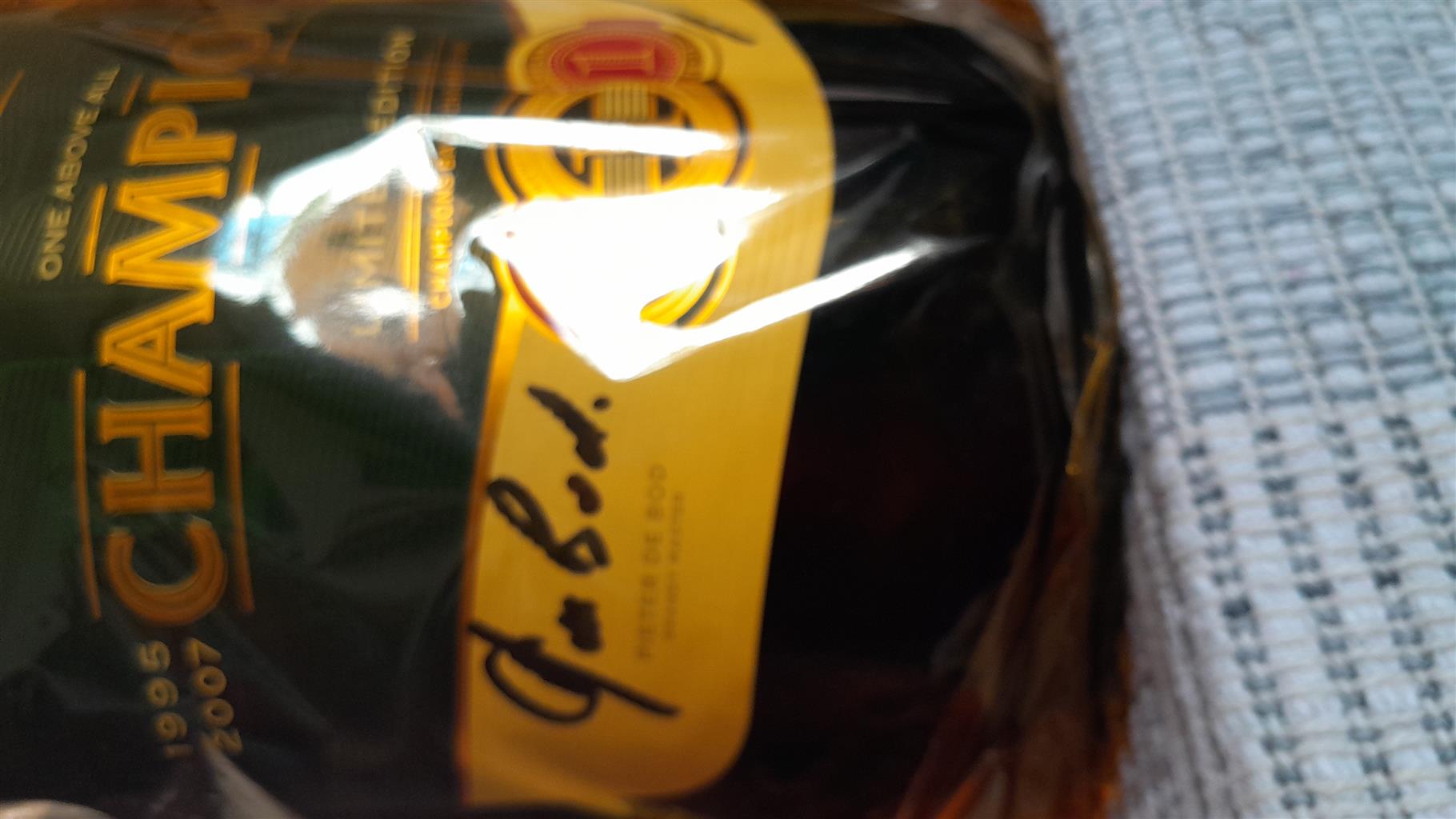 Limited Champions Edition.5year old KWV Bottle signed by Eben Etzabeth.Collector