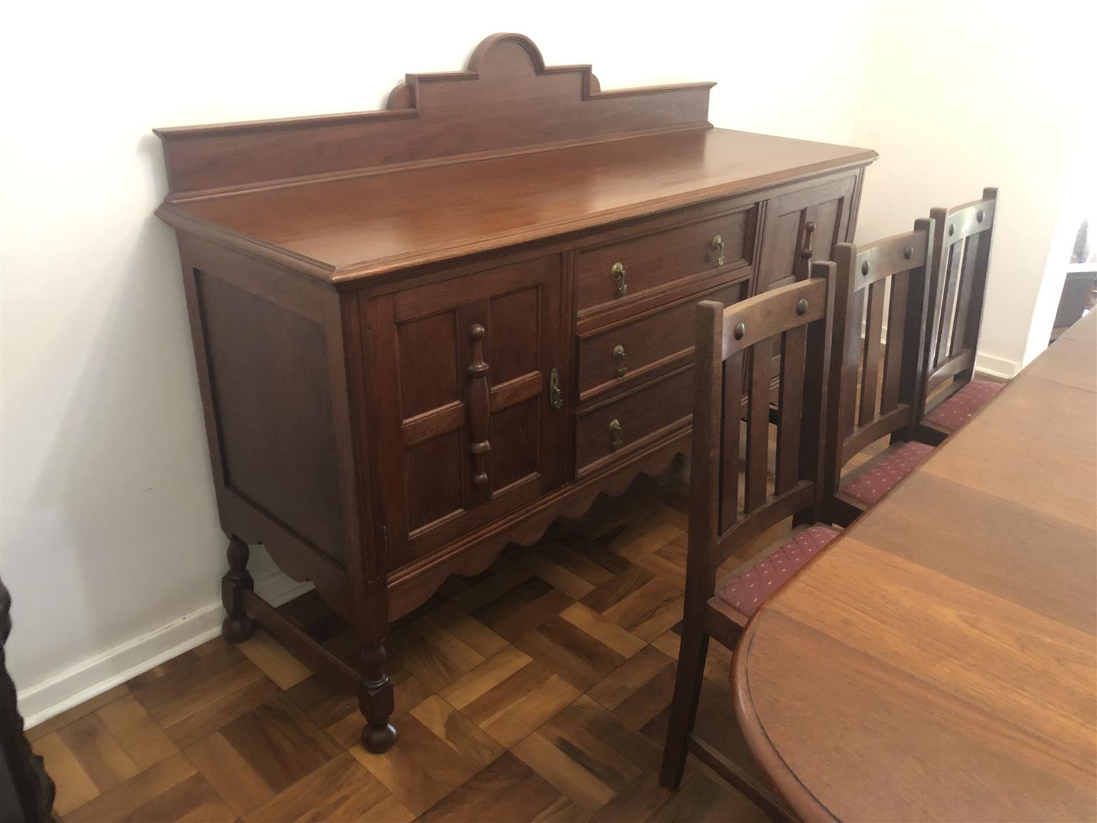 Teak eight seater dining room table with sideboard cupboard and drawers. Antique