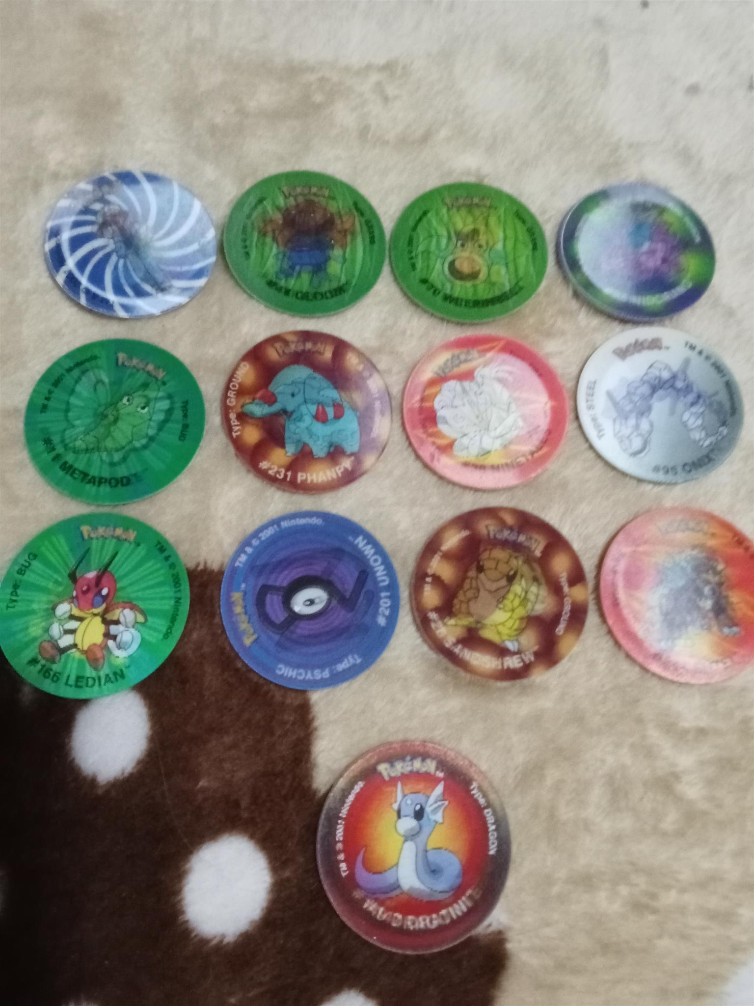 83× Pokemon Tazos with holder