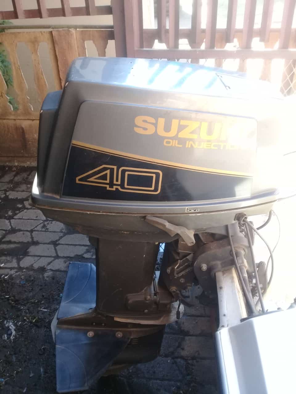 Motorboat with 40 cc Suzuki outboard motor and trailer