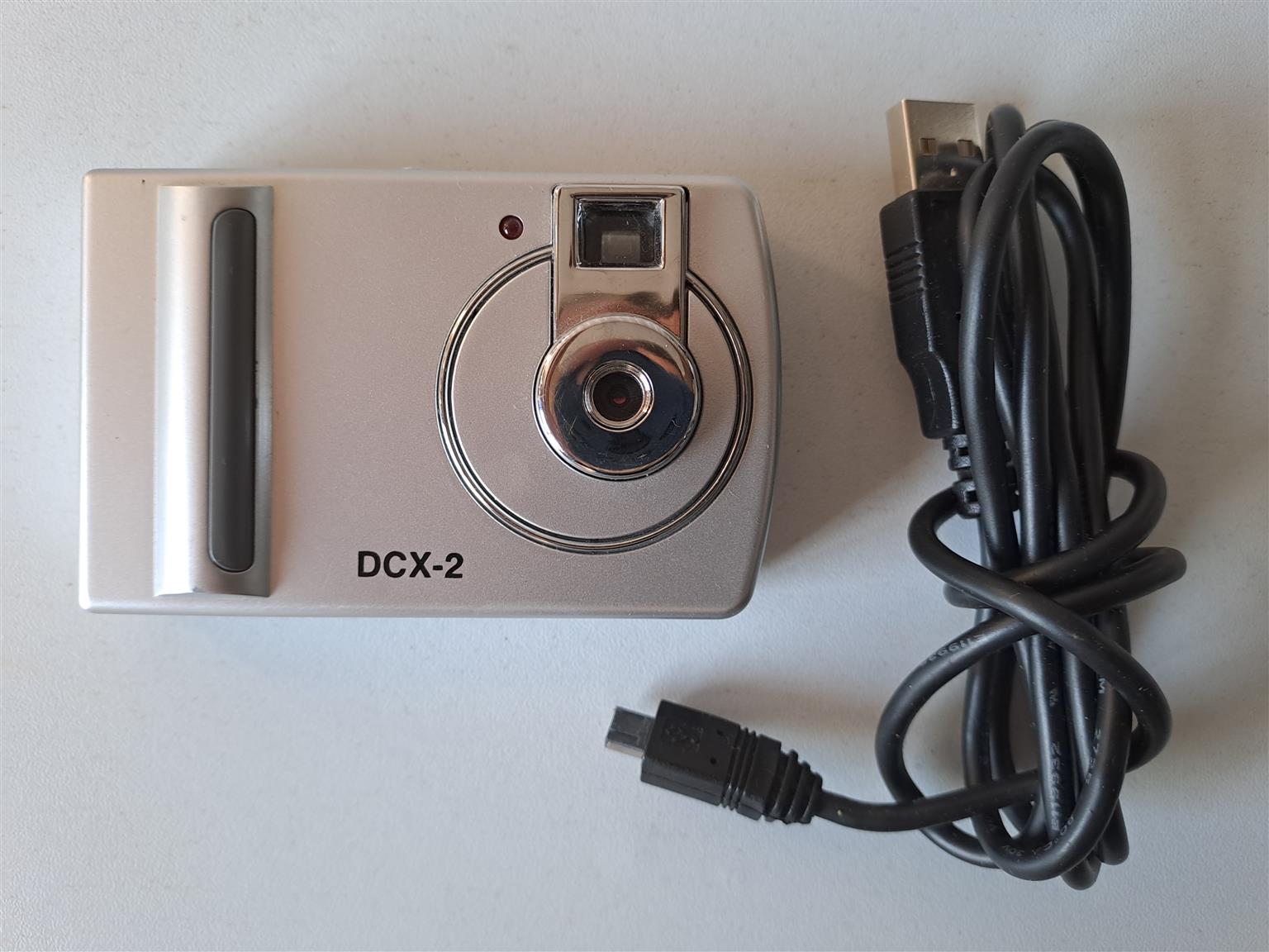 Digital Camera DCX -2 with USB cable. Takes three AAA rechargeable batteries. R5 Digital Camera DCX -2 with USB cable. Takes three AAA rechargeable batteries. R5