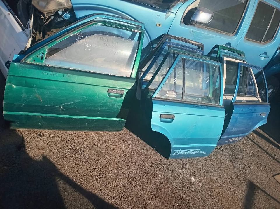 Mazda 323 doors front and rear for sale my number WhatsApp or cell