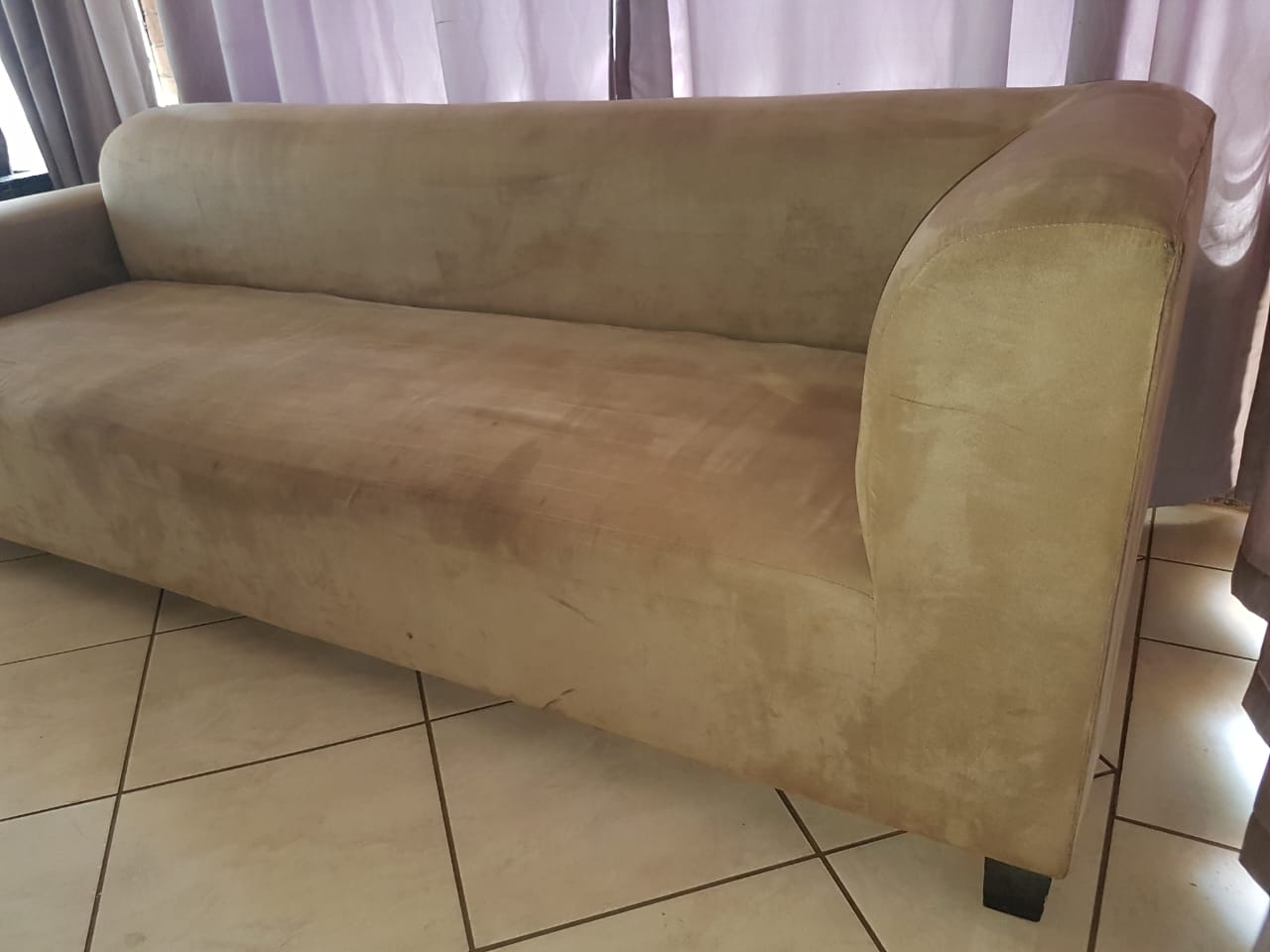 Four seater velour cream coloured couch
