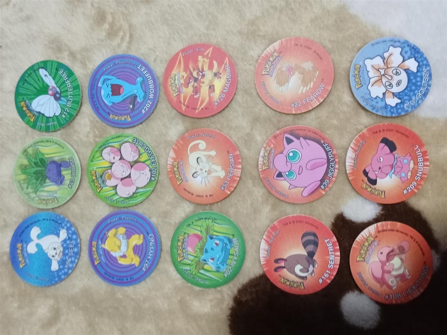 83× Pokemon Tazos with holder