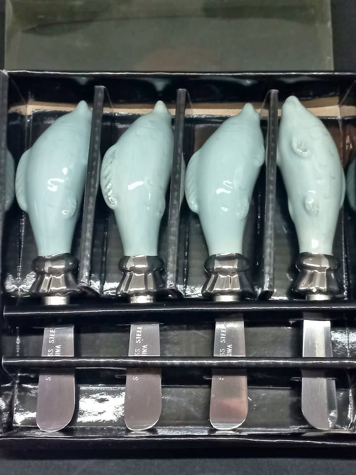 Butter/Cheese knives with ceramic dolphin handles. Butter/Cheese knives with ceramic dolphin handles.
