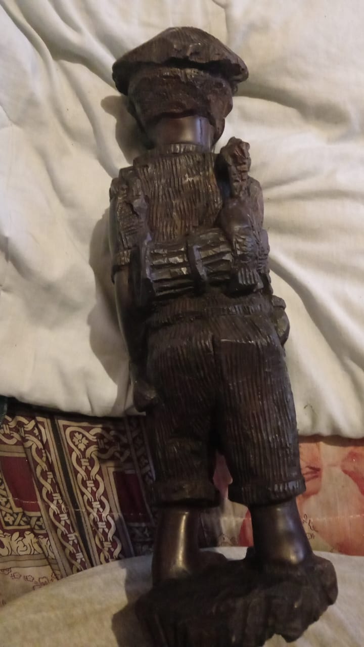Wooden carved statue of a traditional African fisherman
