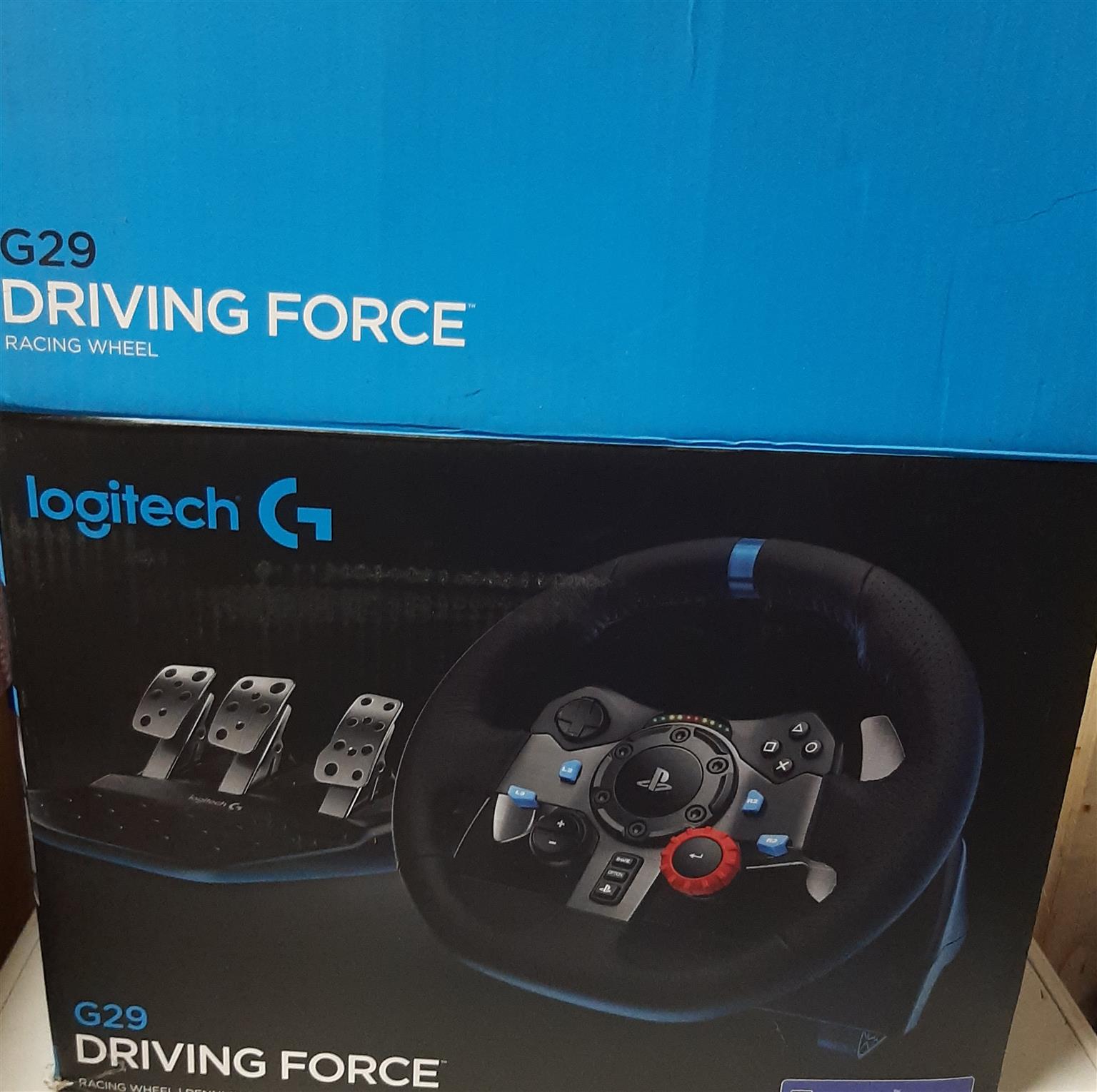 LOGITECH G29 steering wheel with pedals, gear shifter, and accessories