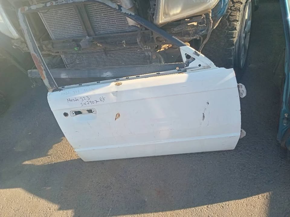 Mazda 323 doors front and rear for sale my number WhatsApp or cell