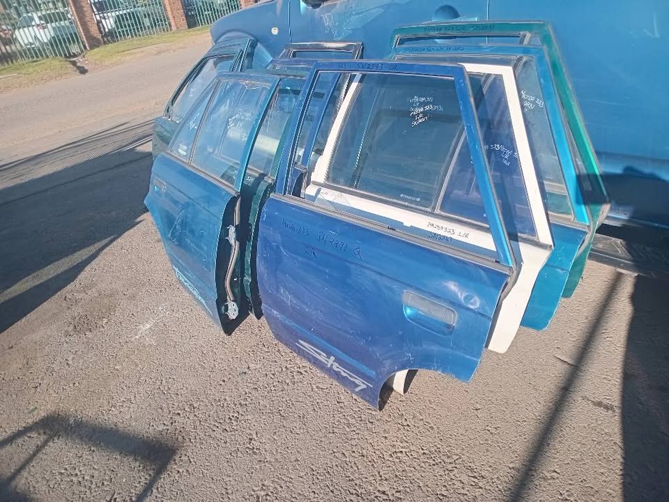 Mazda 323 doors front and rear for sale my number WhatsApp or cell