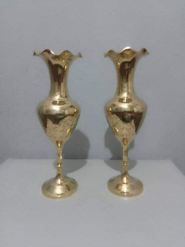 A pair of brass vases