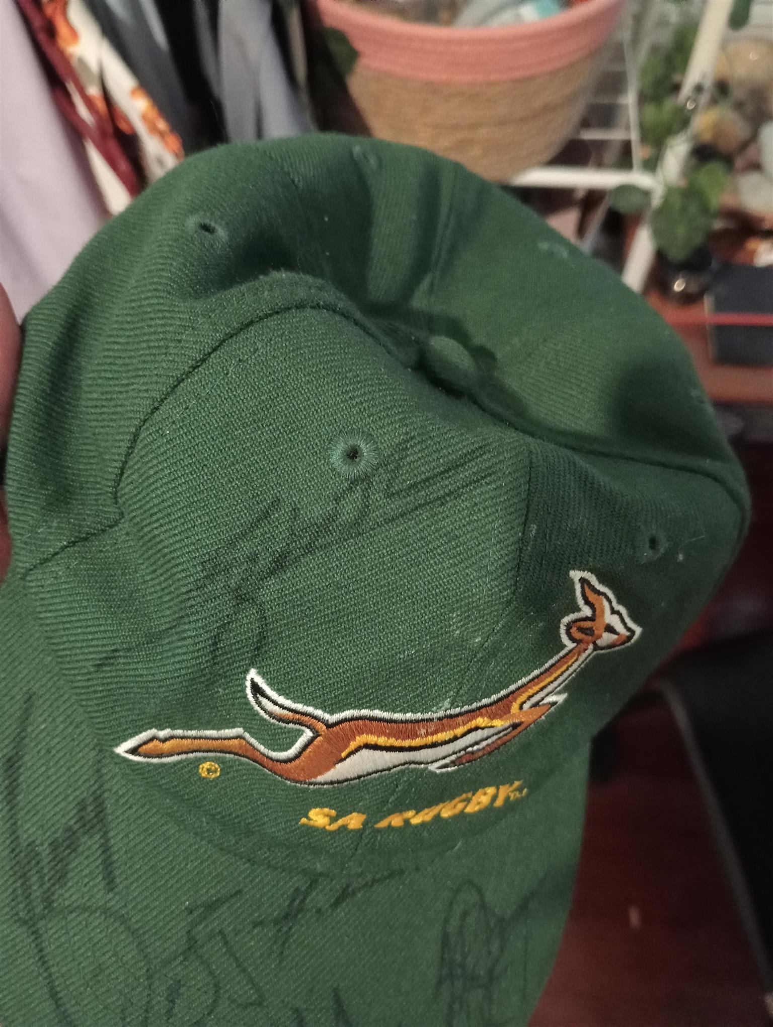 A cap signed by the springbok rugby team.