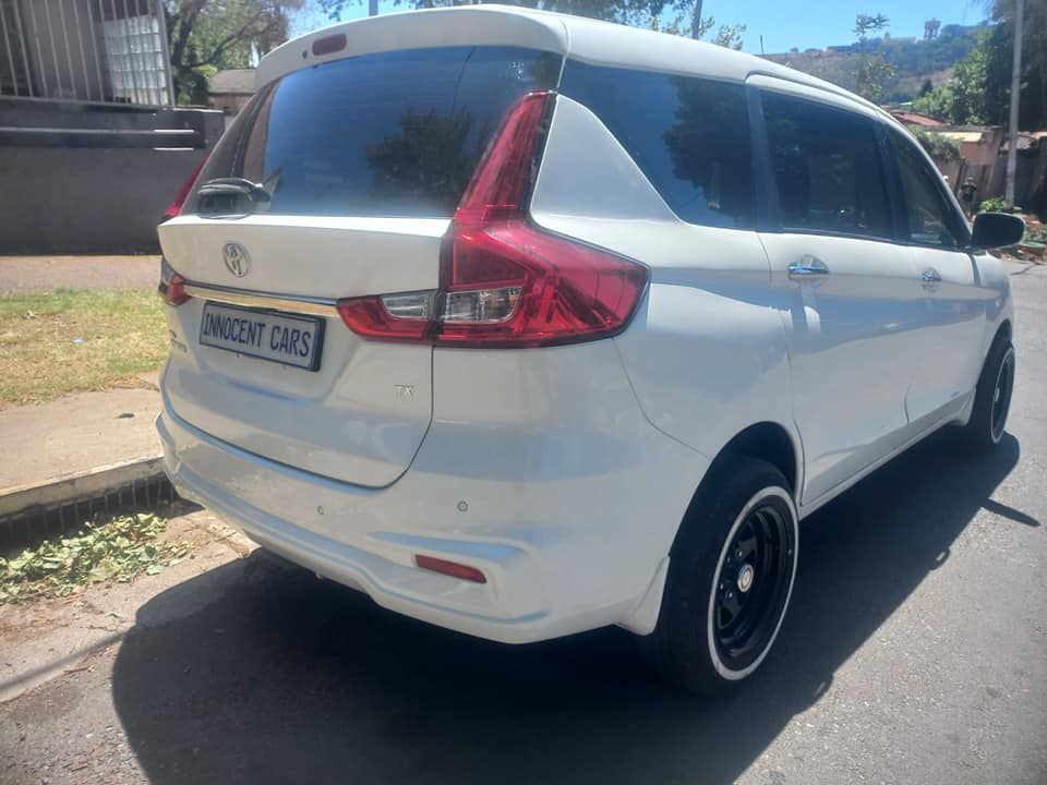 2024 TOYOTA RUMION 1.5TX PETROL, KEYLESS, MANUAL, WHITE COLOR, MILEAGE 32000KMS,