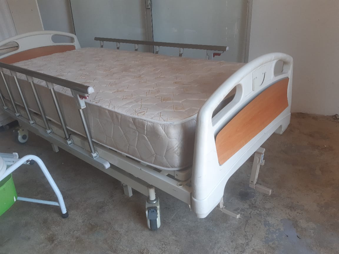 Adjustable hospital bed with mattress, wheelchair and commode for sale