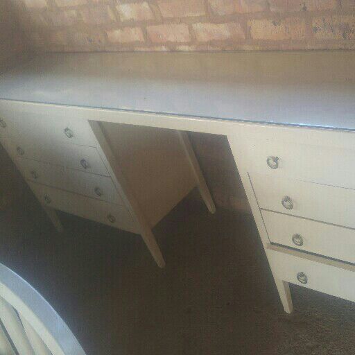 table with drawers on both sides plus small chair