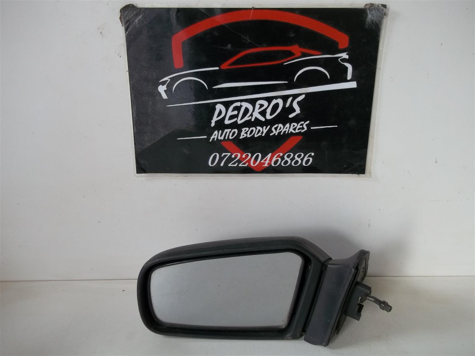Mazda 323 '98 left mirror (Manual) - Private Seller Mazda 323 '98 left mirror (Manual) - Private Seller