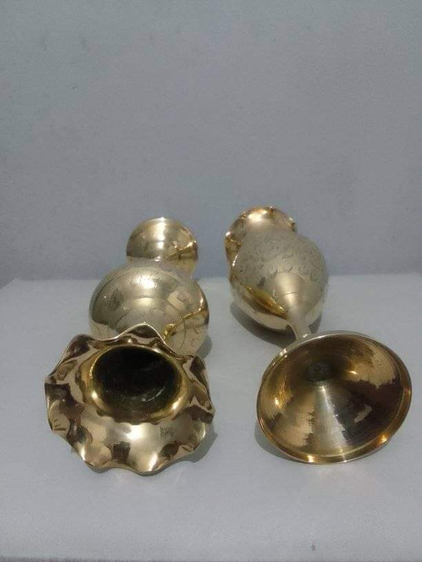 A pair of brass vases