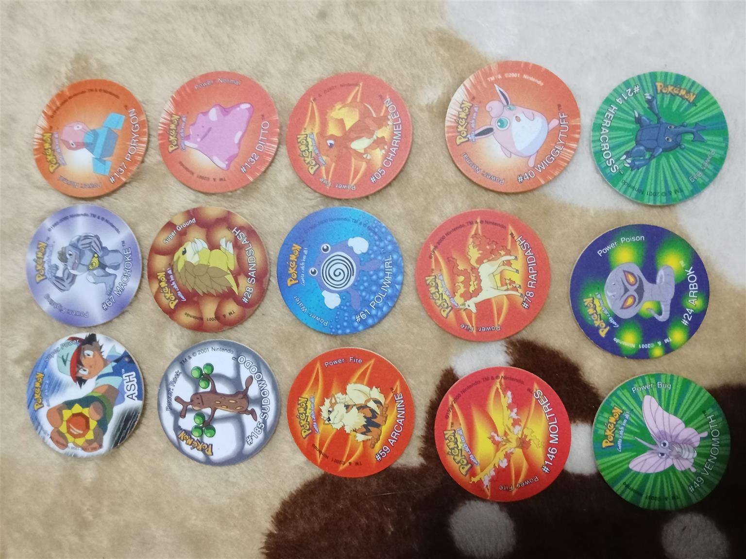 83× Pokemon Tazos with holder