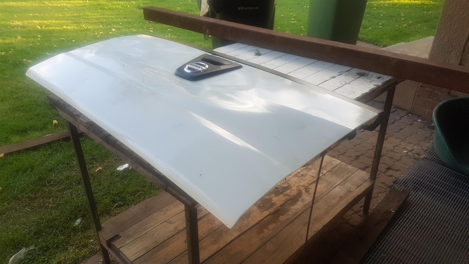 Nissan np200 tailgate with a dent in it but still working fine. - Private Seller Nissan np200 tailgate with a dent in it but still working fine. - Private Seller