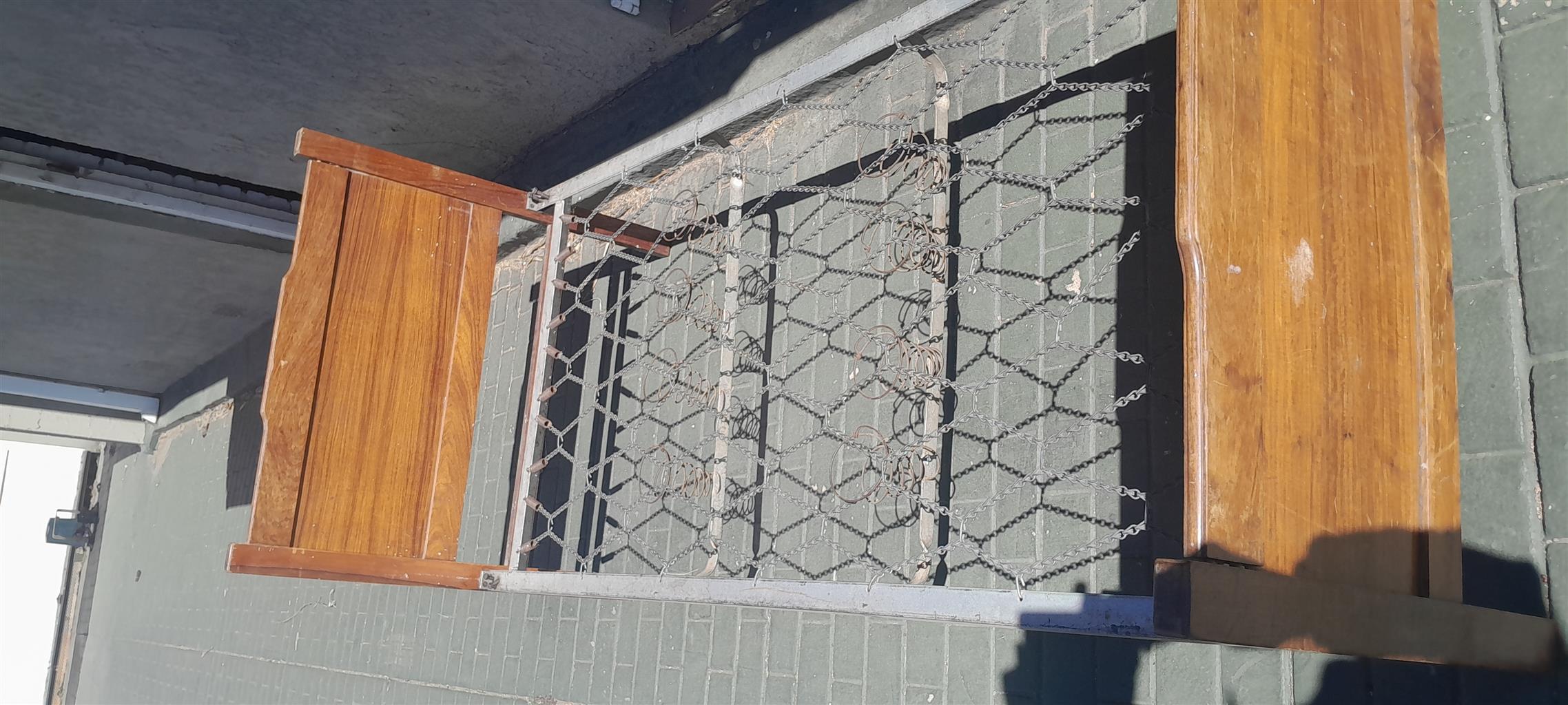 Steel single bed with wooden boards