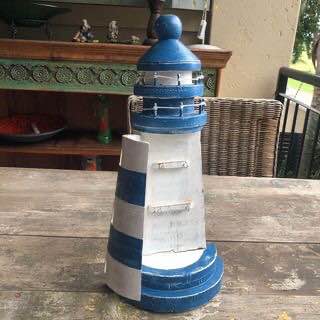 Lighthouse key holder that will bring a nautical flair to your decor. Lighthouse key holder that will bring a nautical flair to your decor.