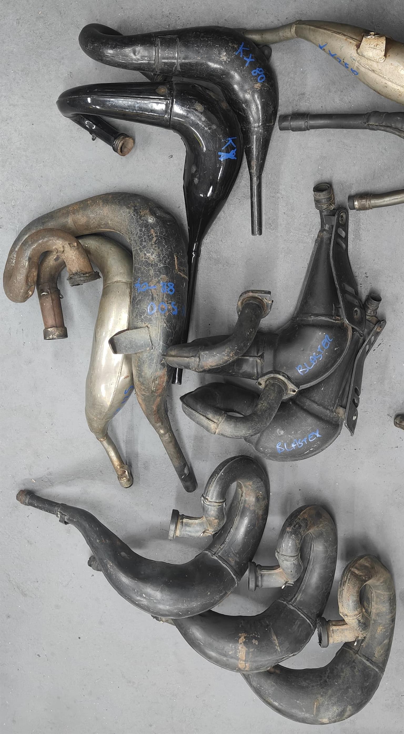 VARIETY OF 2ND HAND 2 STROKE HEADERS FOR SALE.