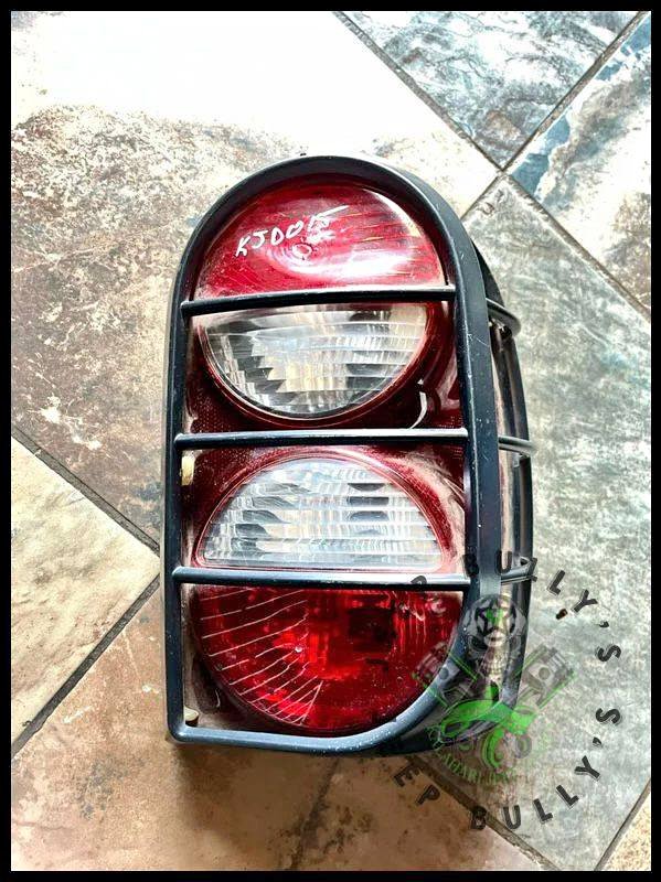 Jeep Liberty (KJ) Renegade Driver Side Tail Light with Guard - Private Seller Jeep Liberty (KJ) Renegade Driver Side Tail Light with Guard - Private Seller
