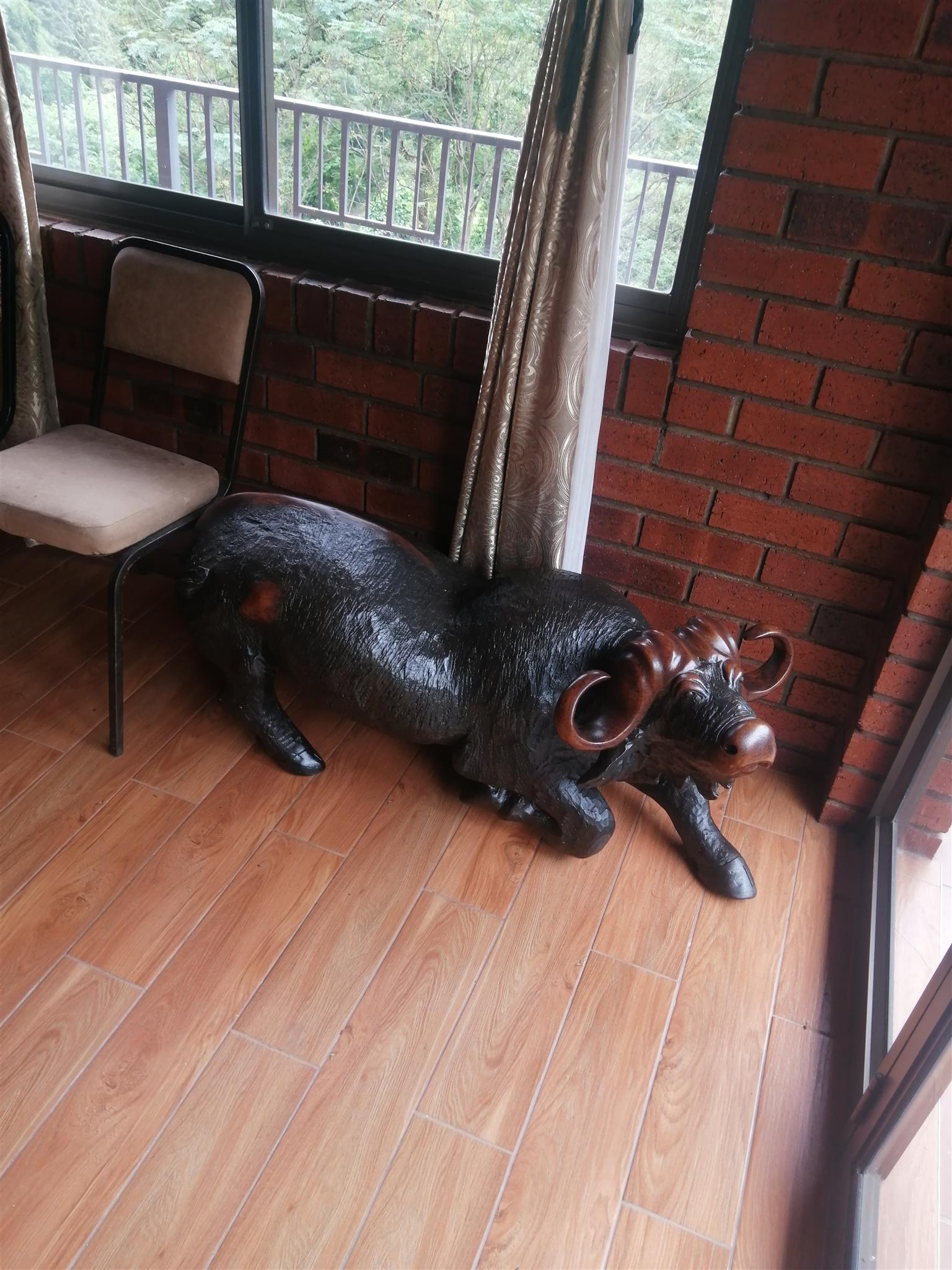 Large Wooden Animal Sculptures. Pair of Buffaloes carved from solid iron wood.