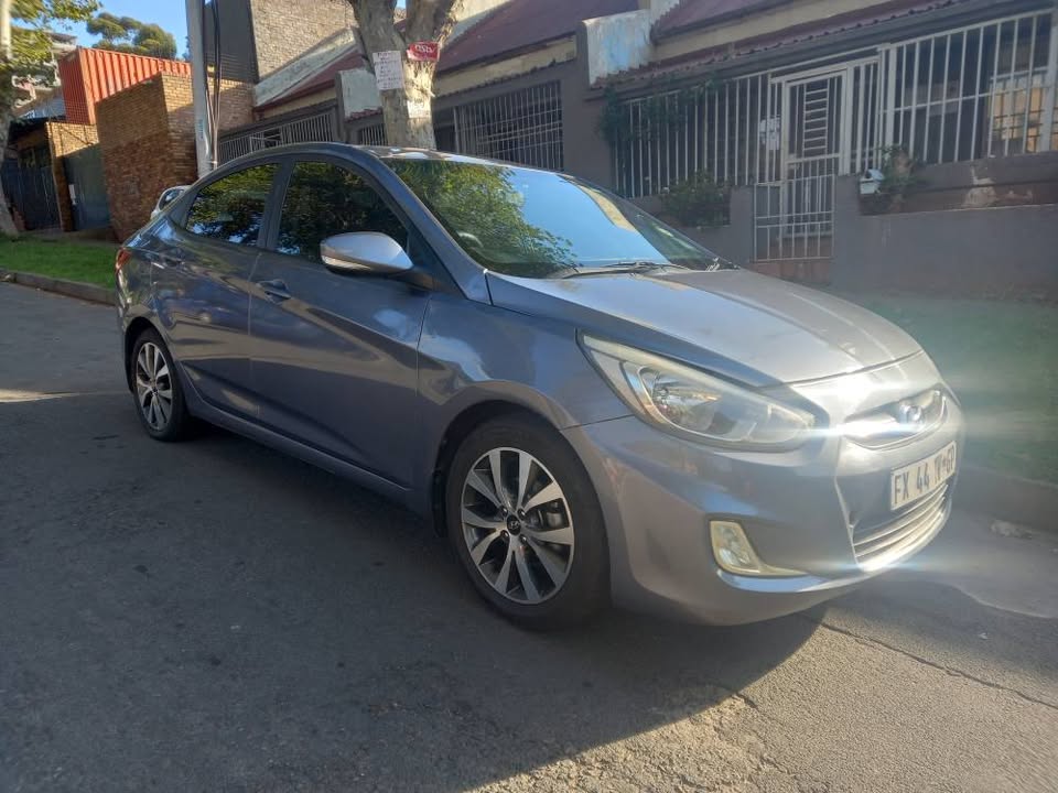 2017 HYUNDAI ACCENT SEDAN 1.6 FLUID PETROL, MANUAL, GREY, 77000kms