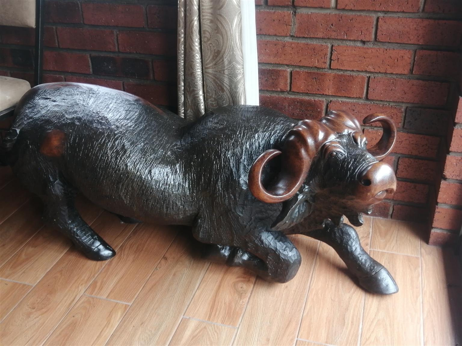 Large Wooden Animal Sculptures. Pair of Buffaloes carved from solid iron wood.