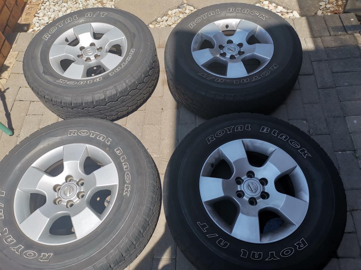 16 inch Nissan Navara original mags with used 255/70/16 Royal Black A/T tyres se - Private Seller 16 inch Nissan Navara original mags with used 255/70/16 Royal Black A/T tyres se - Private Seller