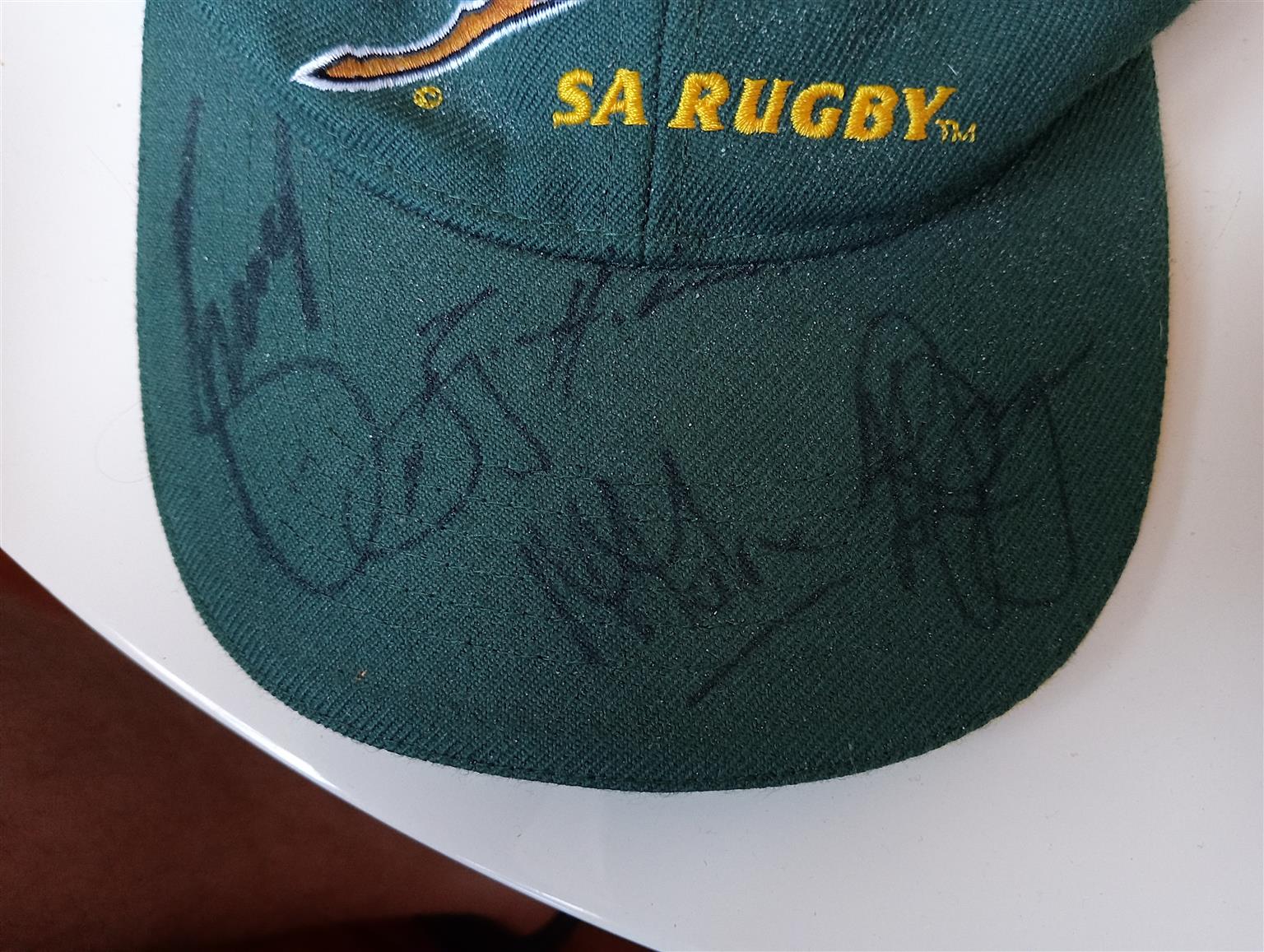 A cap signed by the springbok rugby team. A cap signed by the springbok rugby team.