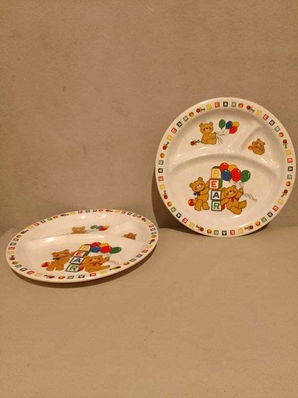 A pair of toddler feeding dish