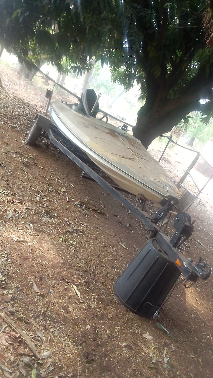 Boat on trailer with 65hp yamaha engin