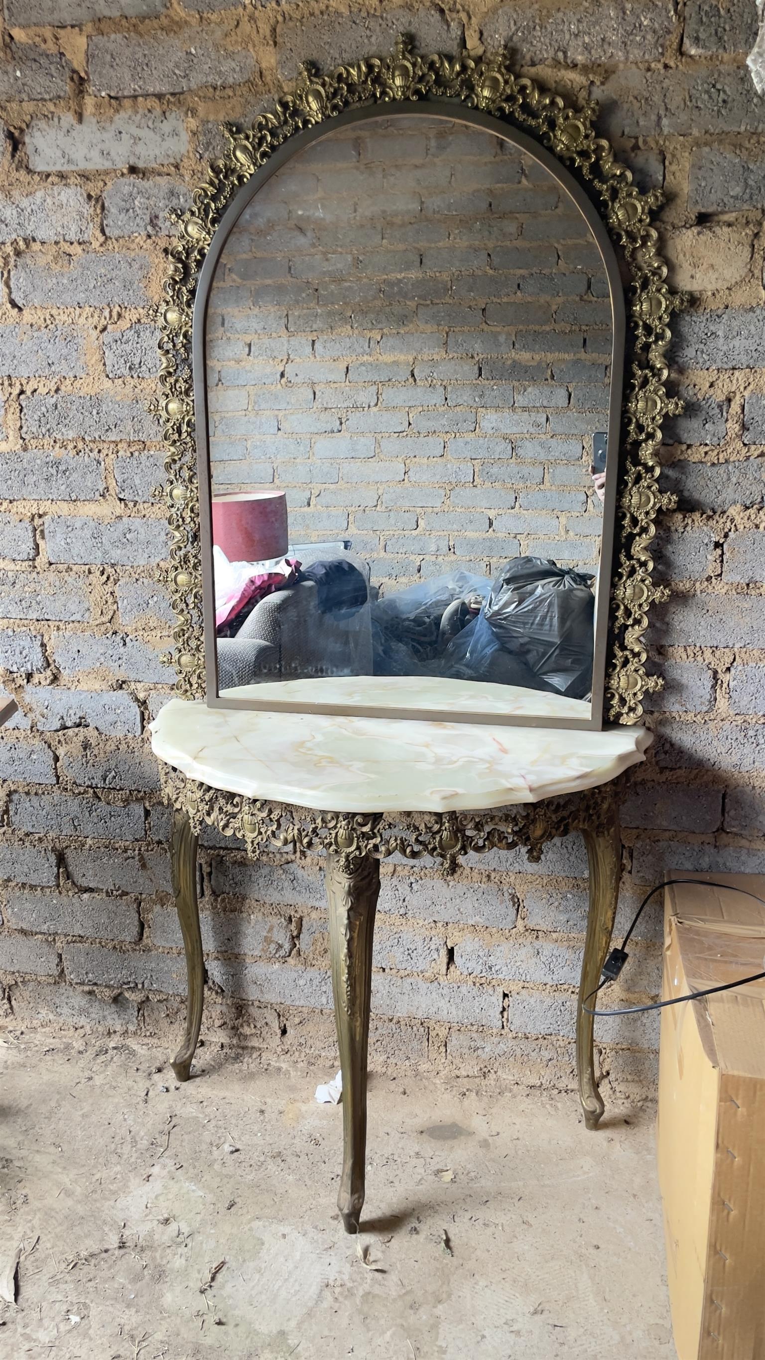 Stunning ornate moulded brass wall mirror and half moon marble table
