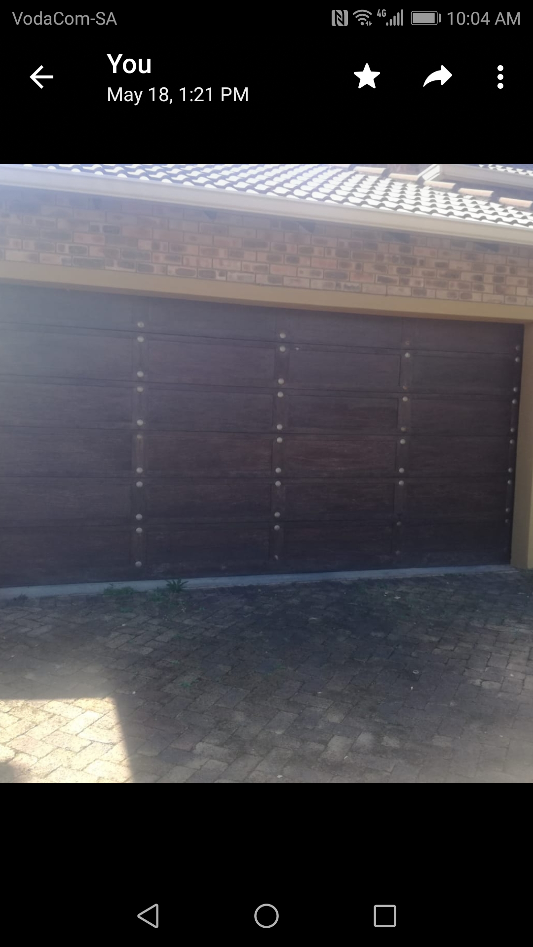 Complete double wooden garage door with hardware in good condition 