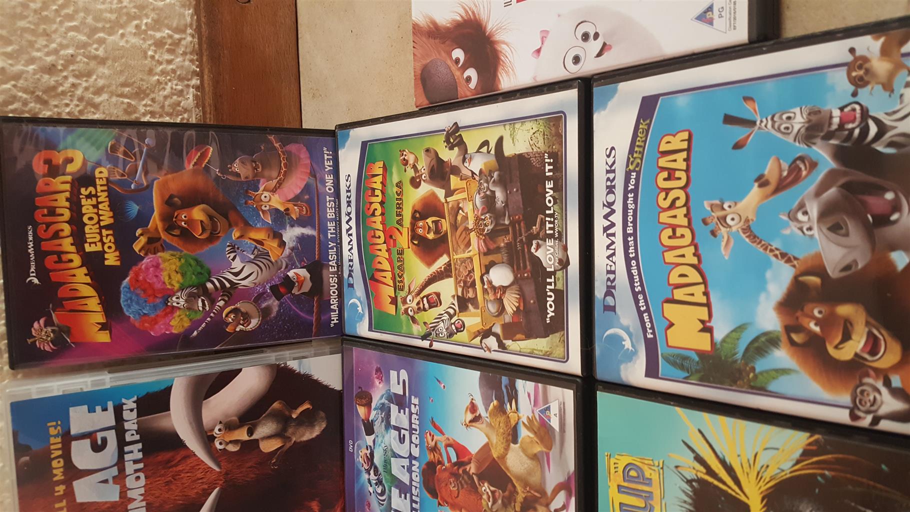 Collection of 14 children's dvds in as new condition.  Includes Ice Age Mammoth Pack, 2 x Cars, etc