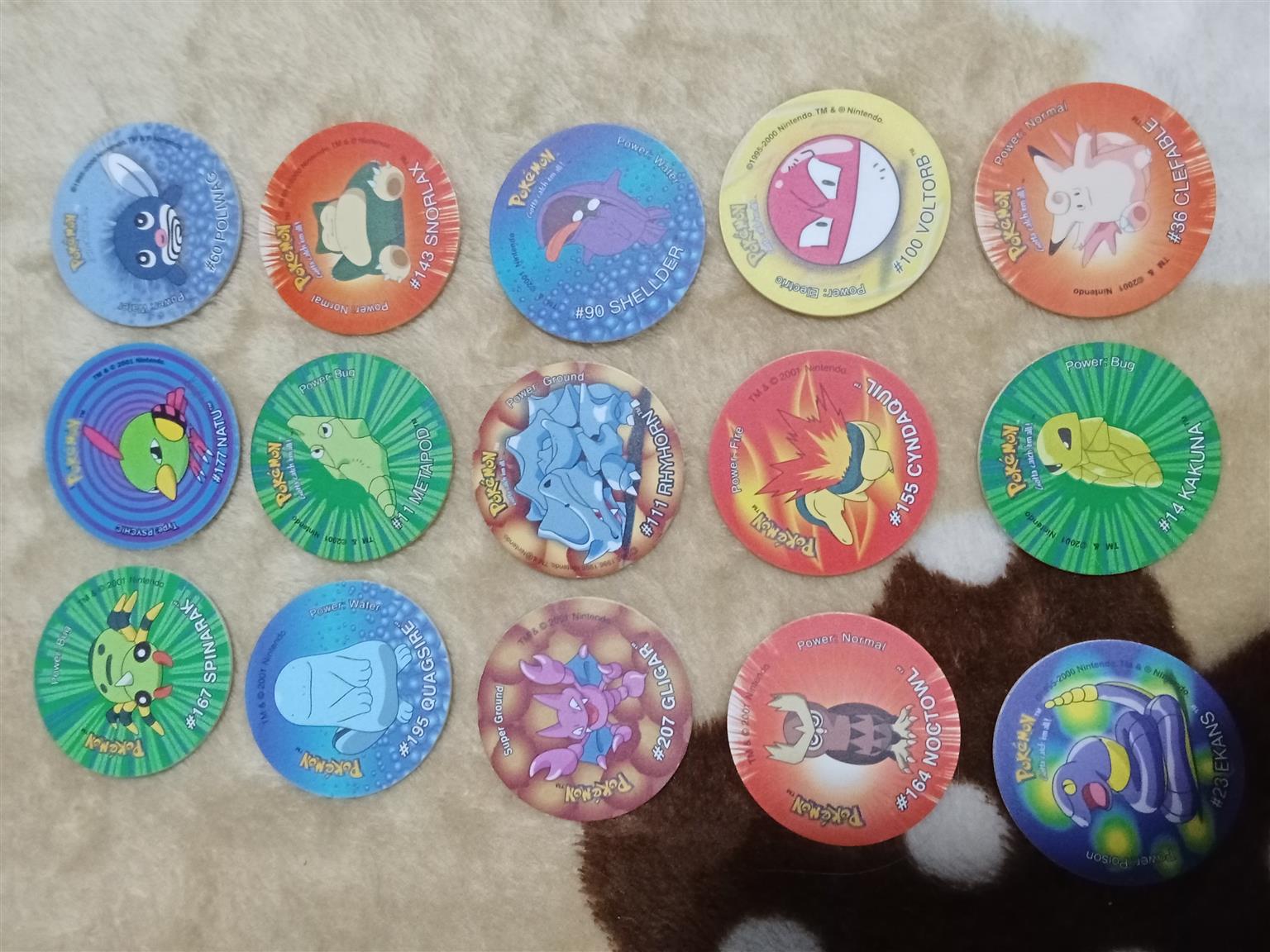 83× Pokemon Tazos with holder