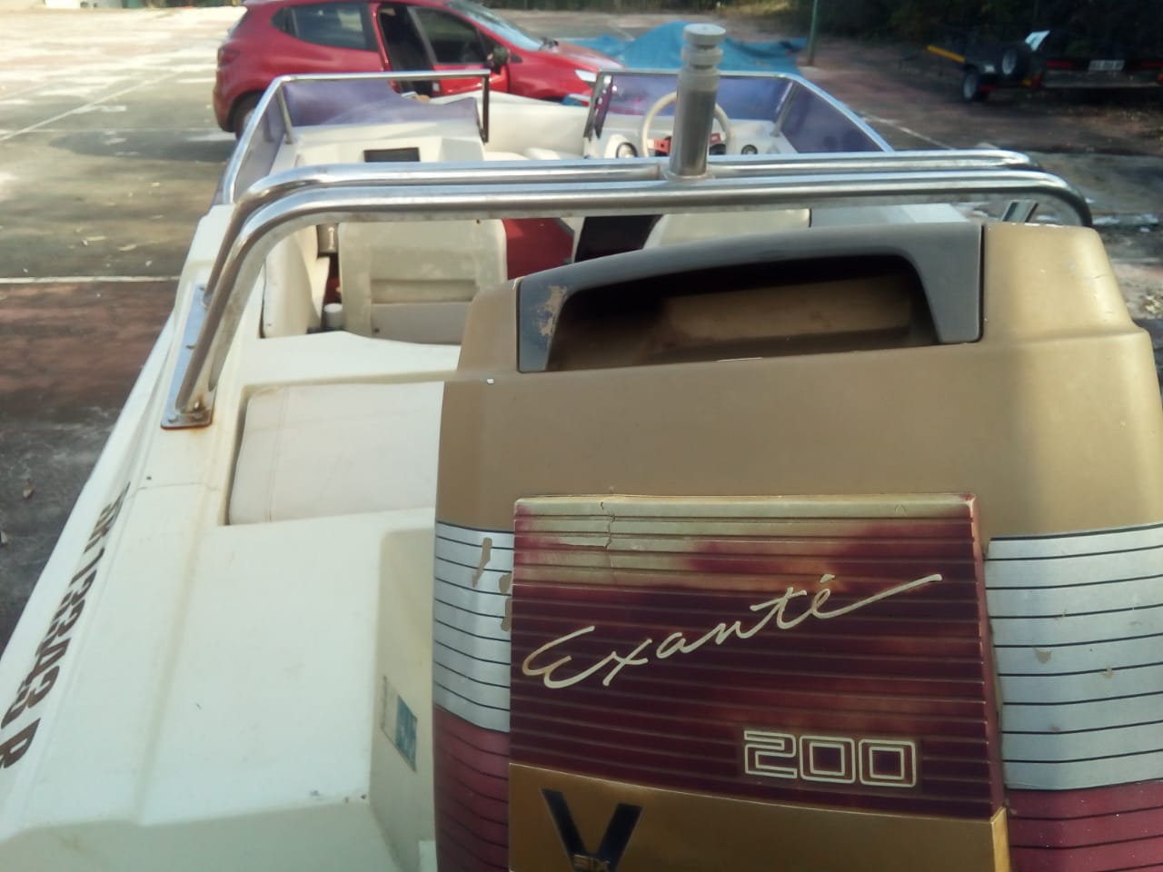 Xtaski boat with 200 motor, in running condition, on trailer