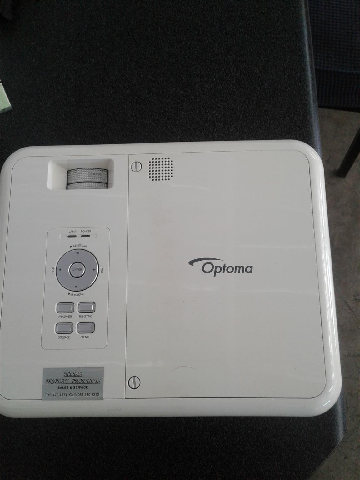Optoma projector.Portable screen and speakers and woofer 