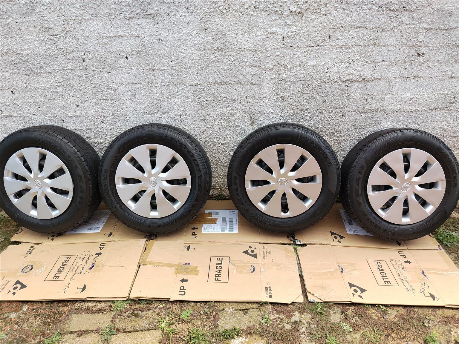 Goodyear excelence allmost new 195-65-15 tyres on corolla quest rims with hubcap - Private Seller