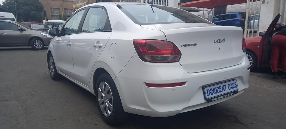 USED 2022 KIA PEGAS SEDAN 1.4 PETROL, MANUAL, WHITE COLOUR, MILEAGE 57000KM