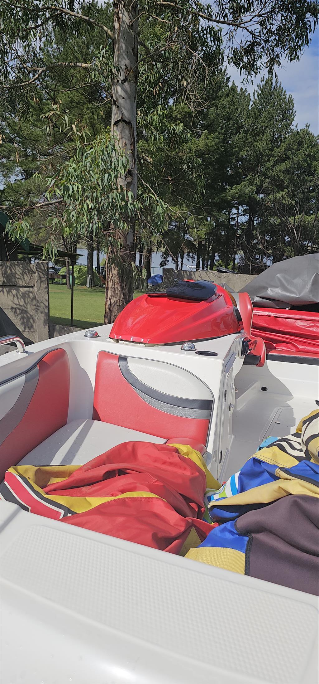 18 ft Exspression Funster boat with 150 Optimax Murcury Motor