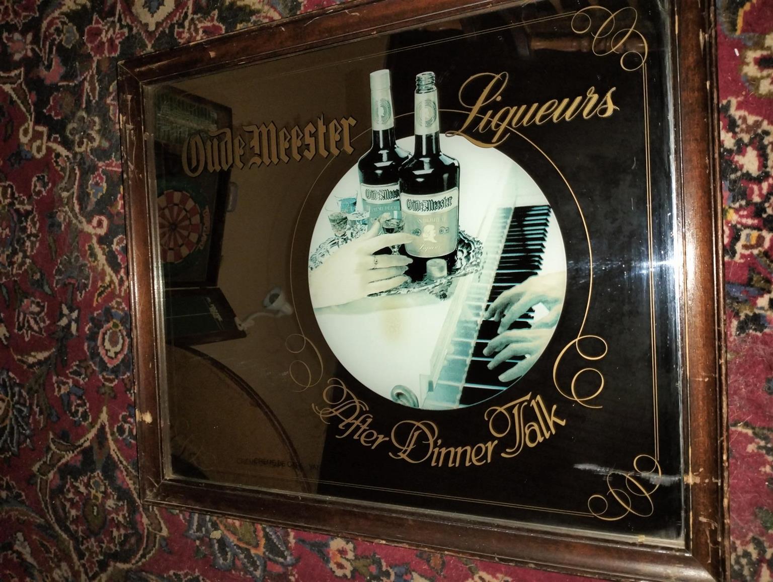 Vintage bar mirror with various alcohol logos