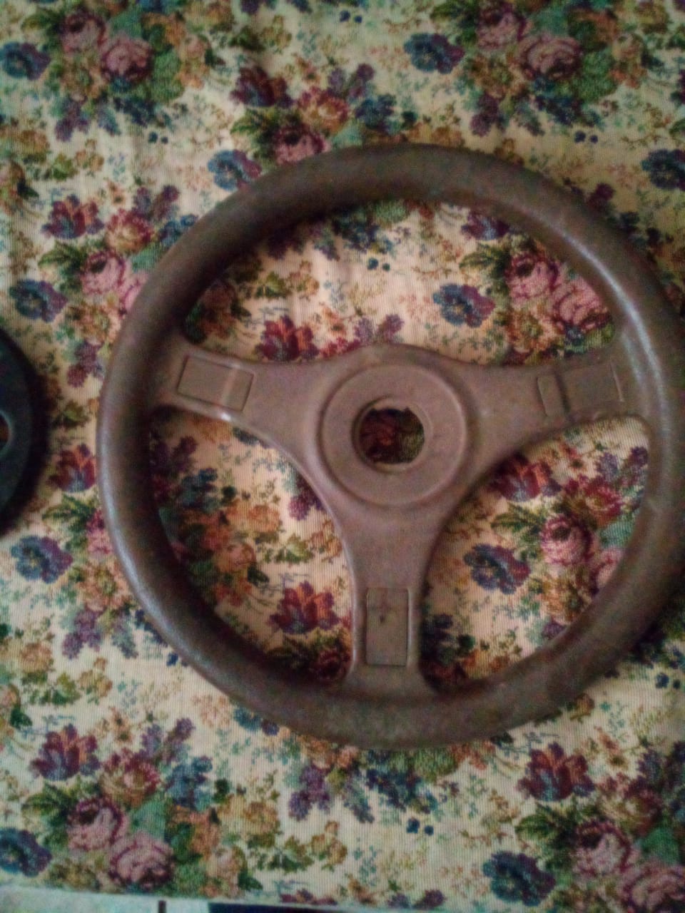 1400 Nissan sport steering wheel and set of 2 hubcaps